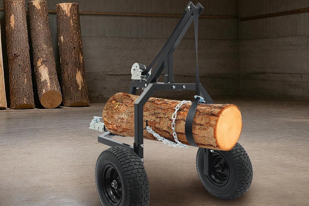 Wheeled ATV log skidding arch holding a short log off the floor
