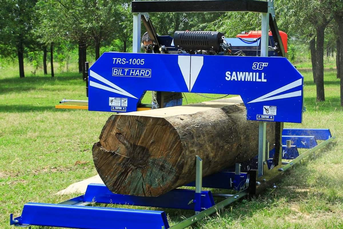BILT HARD 36 inch portable sawmill with a log on the bed on grass