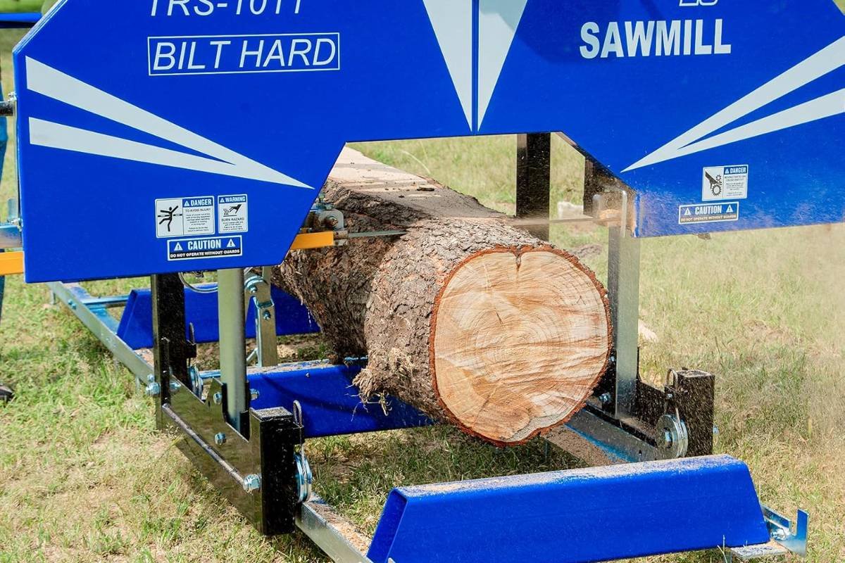 BILT HARD sawmill head straddling a log on the bed