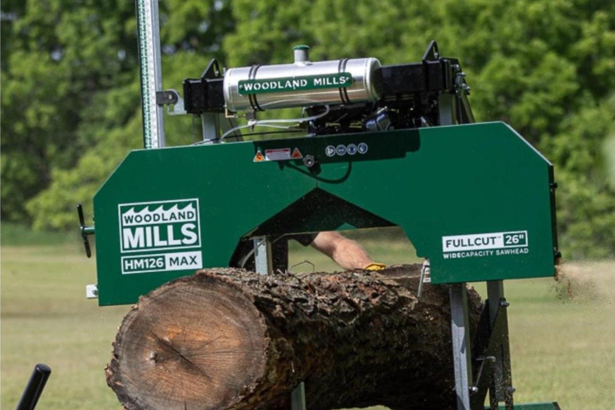 Woodland Mills HM126MAX sawhead with a log on the bed